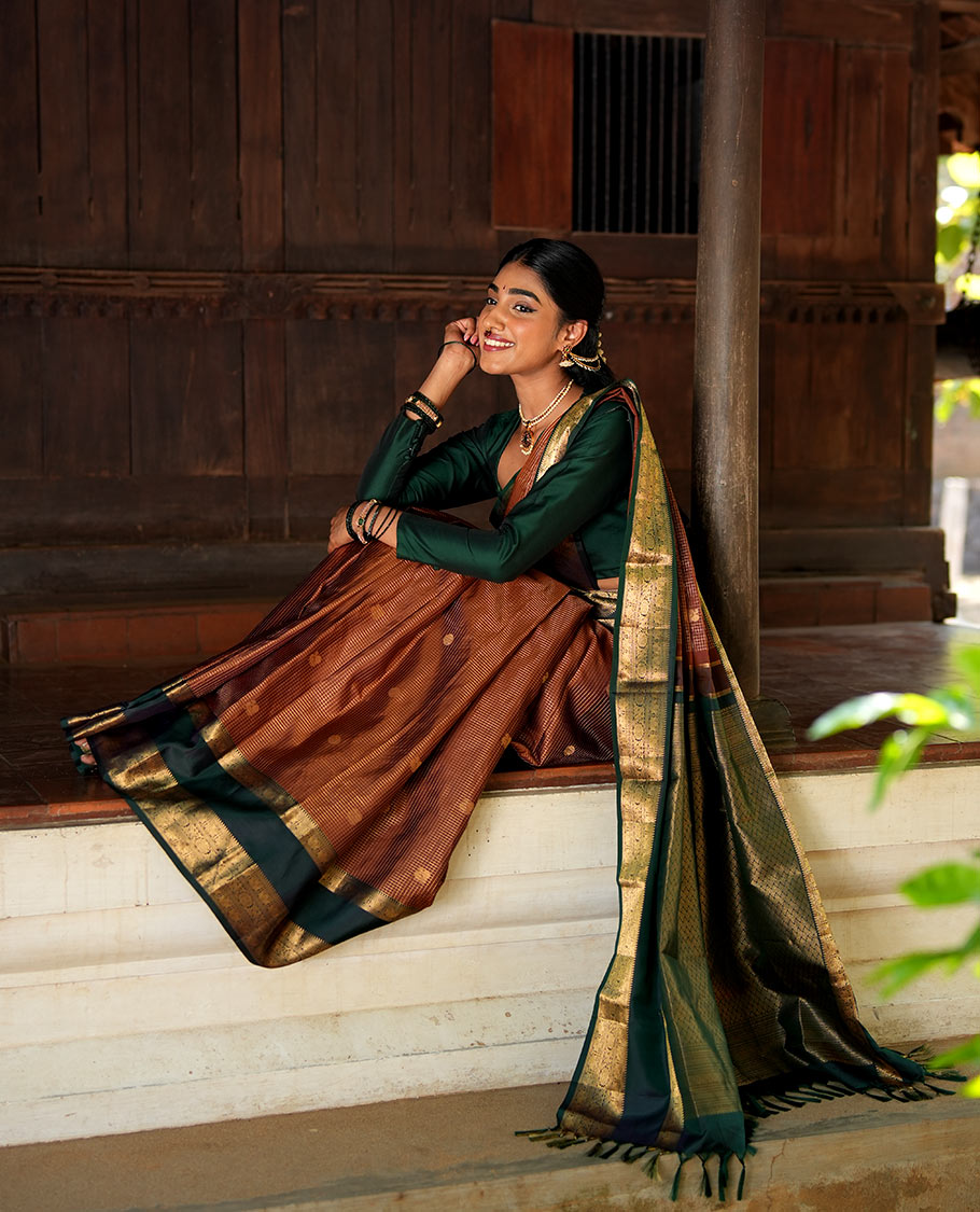 Honey-Coloured Zari Checked with Annam Chakram Buttas Vasundhara silk saree, Contrast Rettai Pettu Border of Ara Bogudi, Muthu, Banaras, Puli Nagam, Iruthalai Pakshi, and Chakram Designs, and Intricate Pallu
