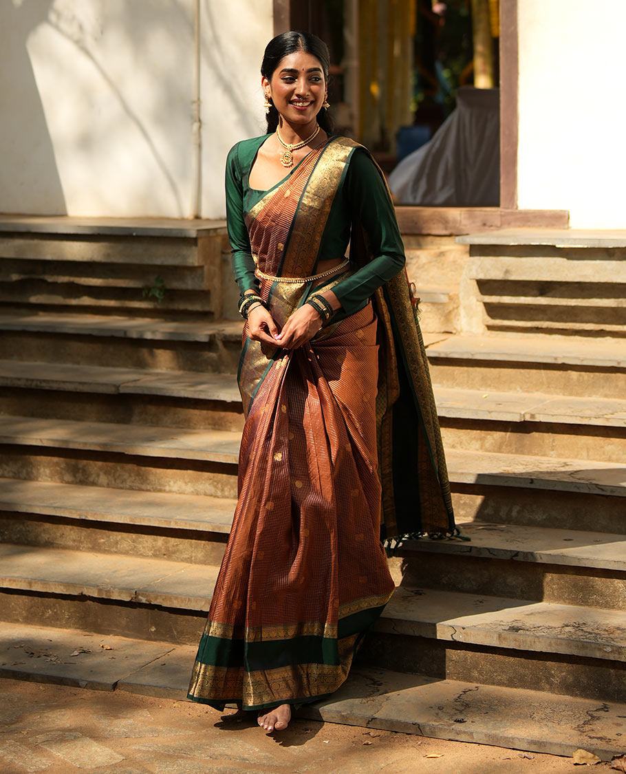 Honey-Coloured Zari Checked with Annam Chakram Buttas Vasundhara silk saree, Contrast Rettai Pettu Border of Ara Bogudi, Muthu, Banaras, Puli Nagam, Iruthalai Pakshi, and Chakram Designs, and Intricate Pallu