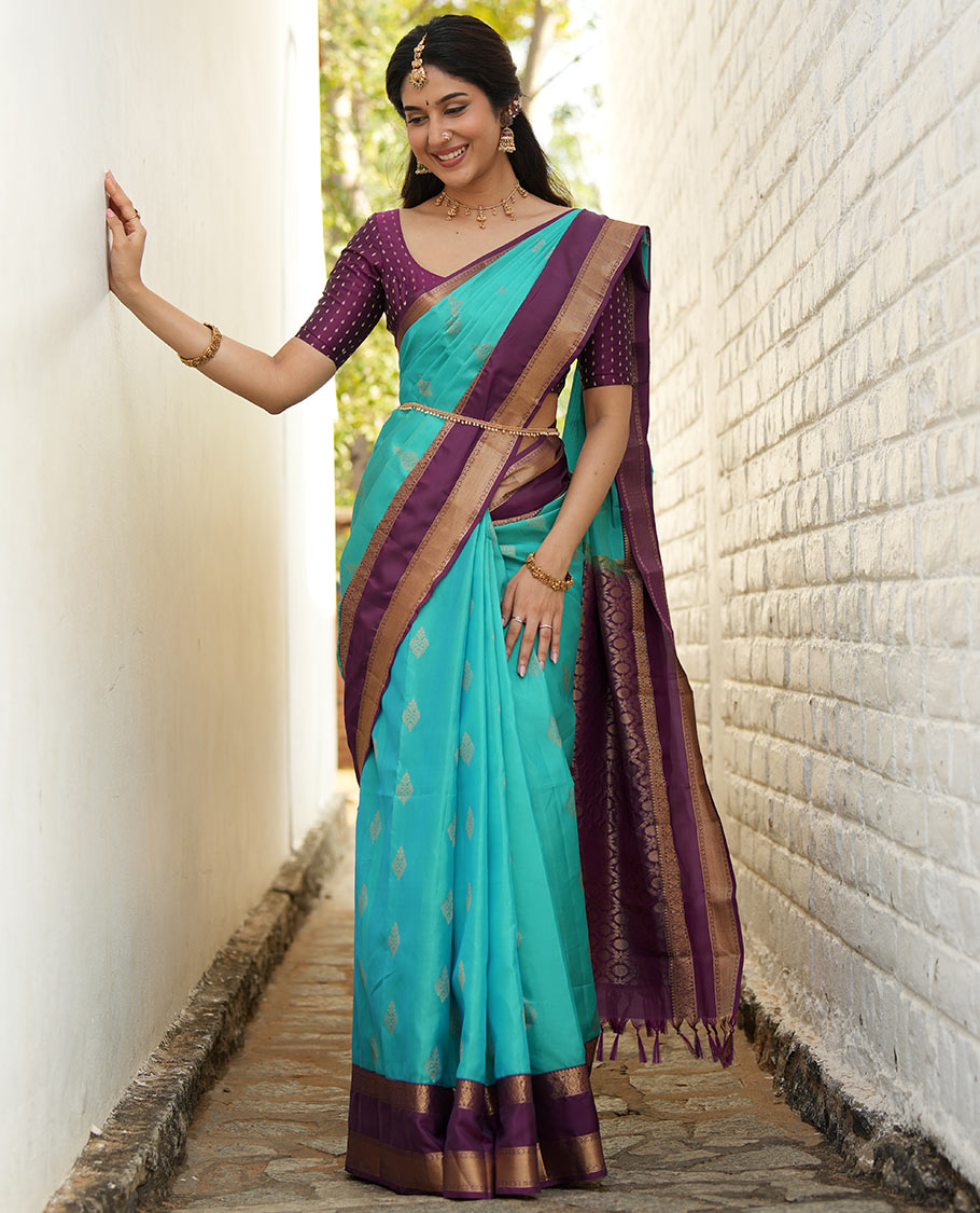 Blue zari buttas woven silk saree, contrast rettai pettu border of laddu kamalam designs, and jaal pallu