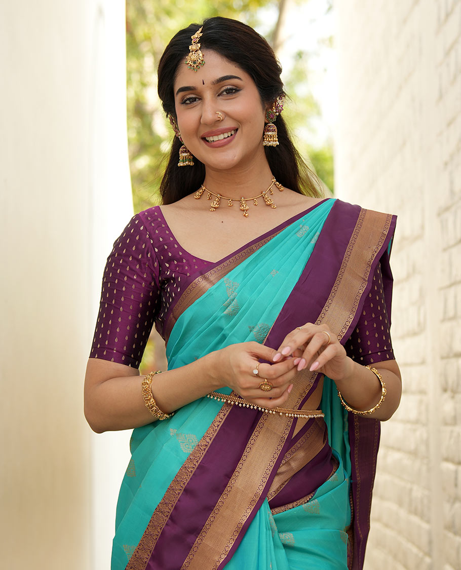 Blue zari buttas woven silk saree, contrast rettai pettu border of laddu kamalam designs, and jaal pallu