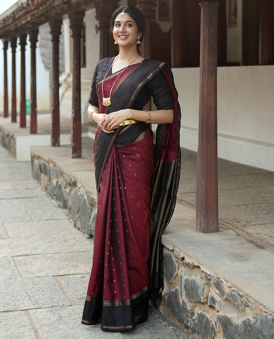 Maroon Poun Buttas Vasundhara Silk Saree, Contrast Rettai Pettu Border of Rekku, Neli, and Rudraksham Designs, and Zari-Rich Intricate Pallu