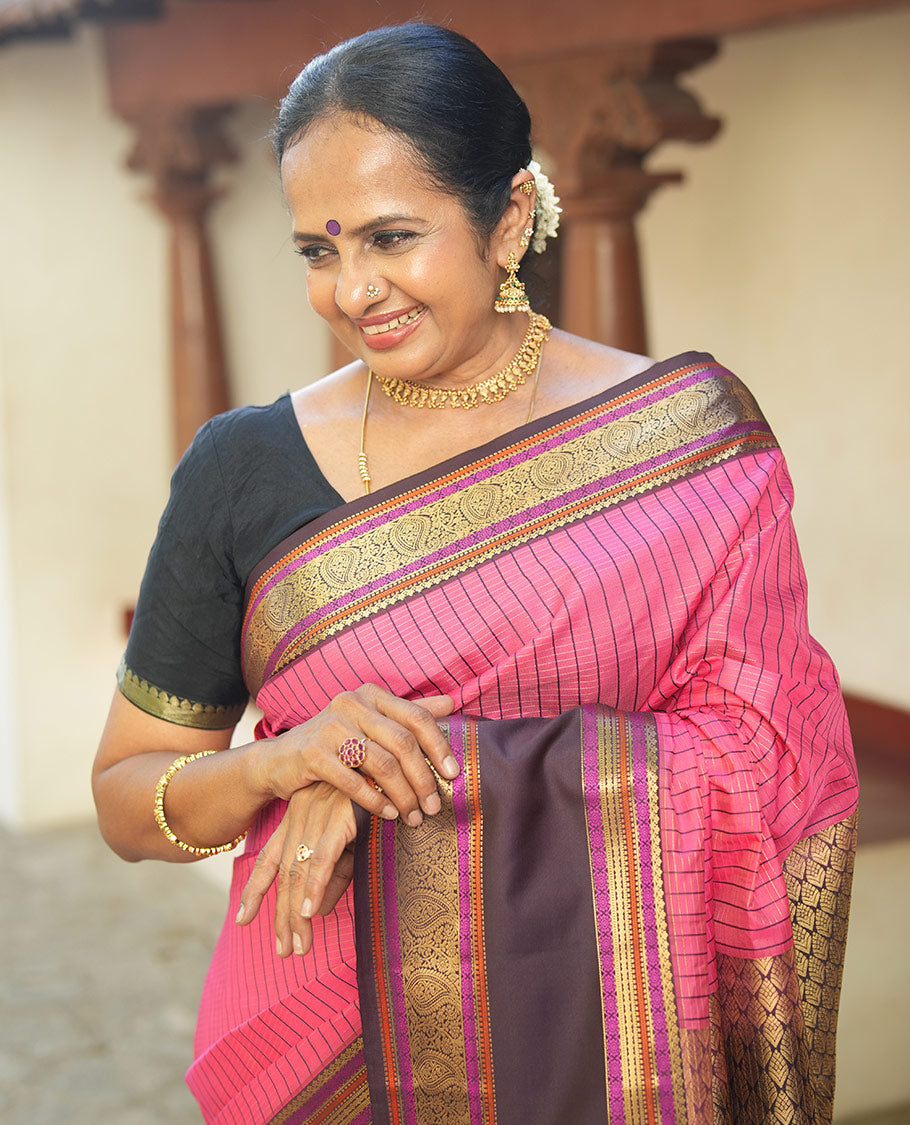 Pink Vasundhara Lite Silk Saree, Subtly Detailed with Thread and Zari Stripes, Complemented by Contrast Rettai Pettu Border of Salngai, Cross Kamalam, Muthu, Kathir, Diamond, and Arumbu Manga Designs, Grand Jaal Pallu, and Paired with a Contrast Blouse