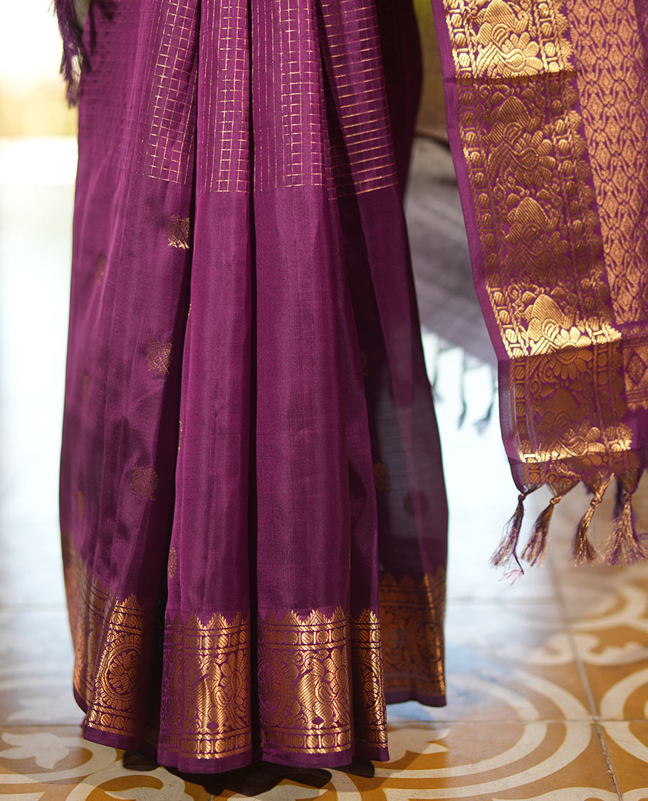 Purple Vasundhara Lite Silk Mix Saree, Artfully Detailed with Mayil-Chakram Buttas and Zari Checks All Over Its Body, Highlighted by a Zari Border of Thazampoo Rekkum, Paisa, Mayil, and Chakram Designs, a Grand Pallu, and Paired with a Matching Blouse