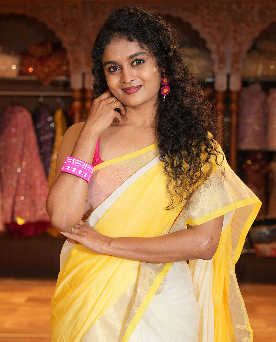 Cream and Yellow Plain Khadi Mul Cotton Saree Features a Gleaming Zari Bavanji Border, and a Contrast Yellow Plain Blouse