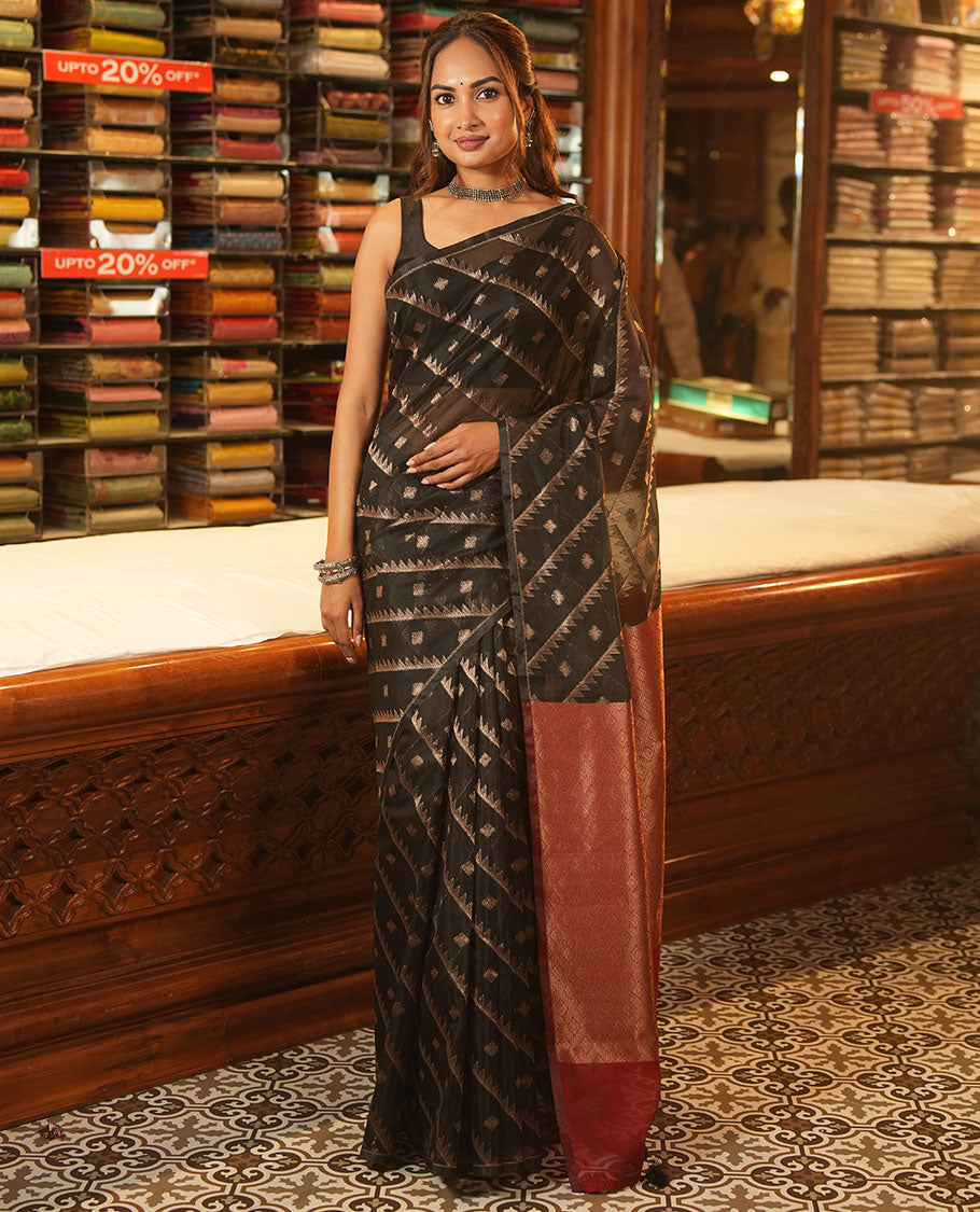 Borderless Black Chanderi Cotton Saree, Adorned with Zari Buttas and Temple Stripes on Its Body, Complemented by Contrast Pallu of Jaal Designs, and Paired with a Contrast Jacquard Blouse