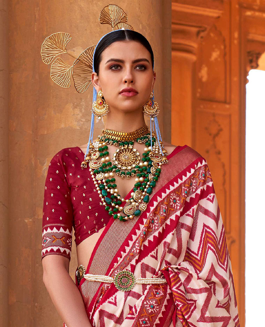 Cream and red chevron stripes printed designer saree, geometric printed border, and ikkat design pallu