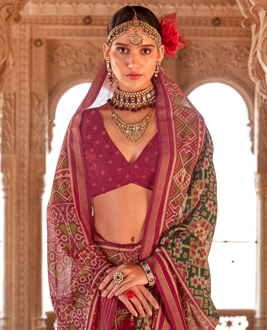 Green Ikat Patola Designer Saree, Graced with Intricate Ikat Designs, Complemented by a Contrast Ikat Border, Intricate Pallu, and a Contrast Blouse