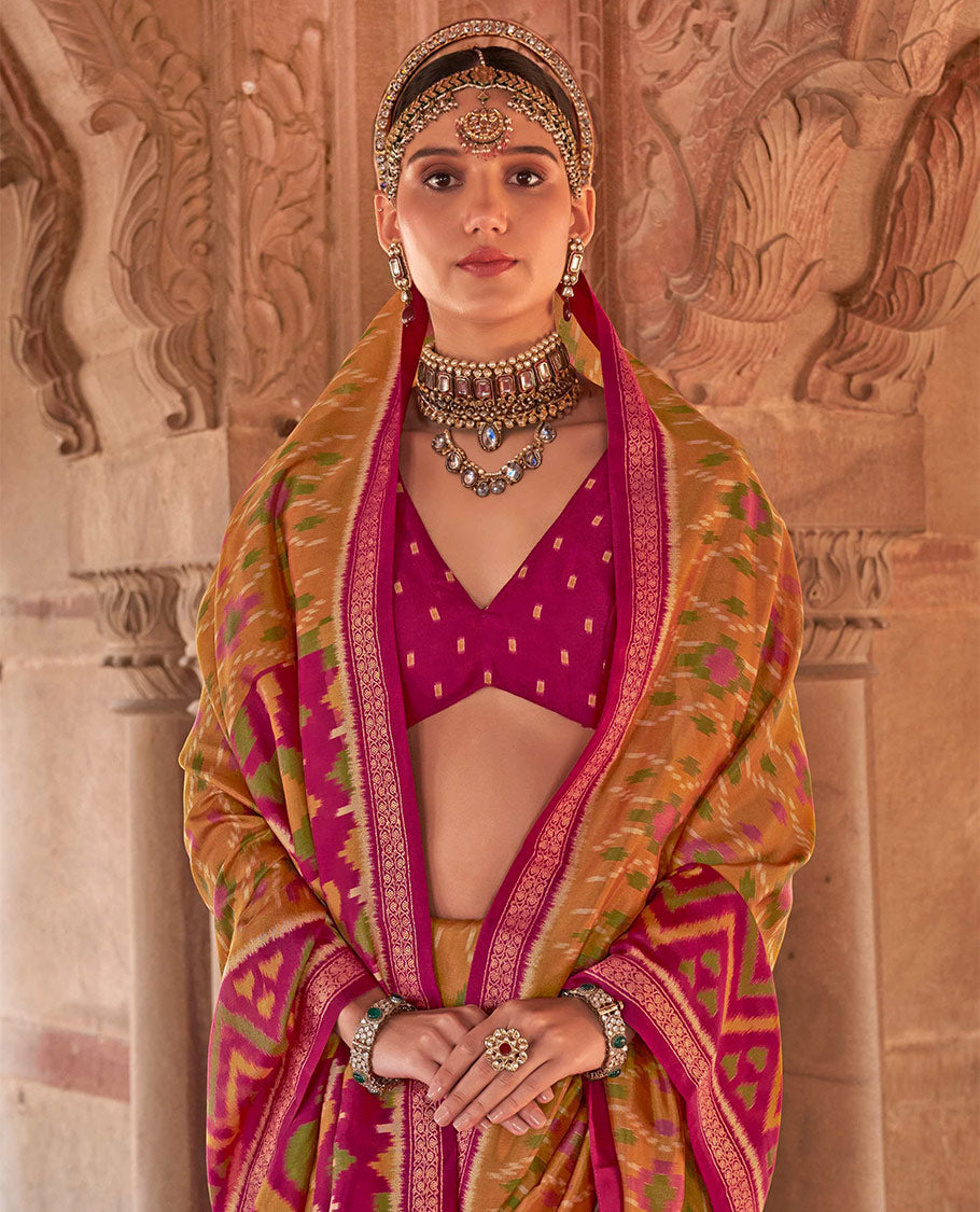 Light Mustard Ikat Patola Designer Saree Featuring Geometric Ikat Designs, Complemented by a Contrast Ikat Border, Intricate Pallu, and a Contrast Blouse