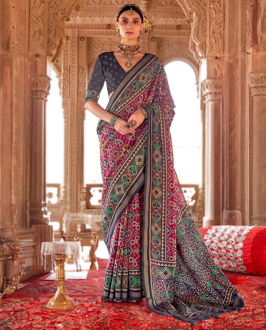 Wine Ikat Patola Designer Saree, Elevated with Intricate Ikat Designs, Complemented by a Contrast Ikat Border, Intricate Pallu, and a Contrast Blouse