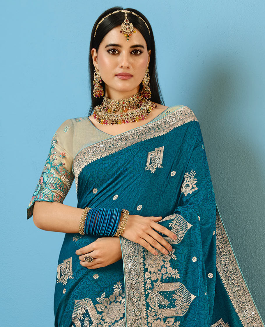 Blue Designer Saree Decorated with Buttas and Embossed Effect, Self-Border Complemented by Mughal-Inspired Motifs, Pallu of Embroidery, and a Contrast Embroidered Blouse