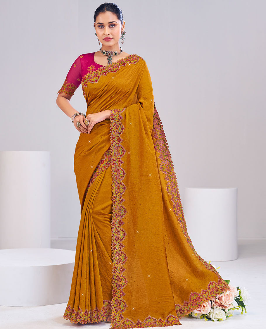 Mustard designer catalog saree with micro-stones sticked all over its body, scallop floral embroidered border