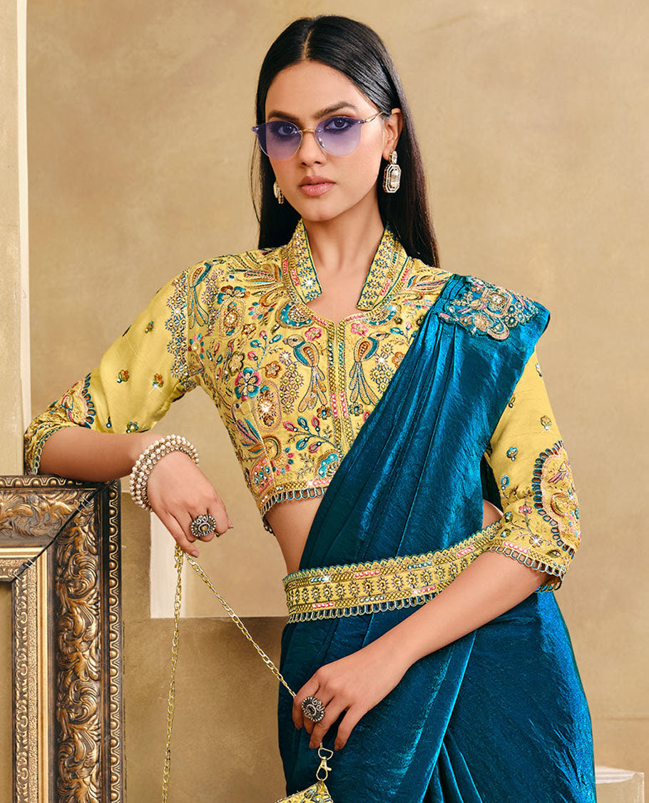 Blue Plain Party Wear Designer Saree, Complemented with a Contrast Collared Neck Heavy Embroidered 3/4th Sleeve Readymade Blouse, Detachable Embroidered Belt, and a Free Embroidered Flap Sling Bag