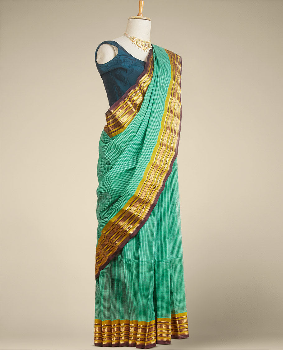 Green micro-checked gadwal saree, contrast border & pallu steeped with traditional zari designs