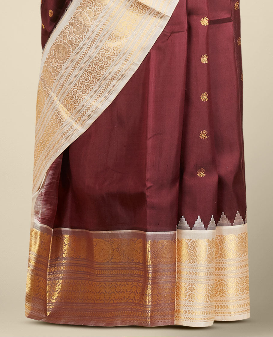 Maroon gadwal silk saree with zari buttas, contrast vidarbha zari border & pallu featuring peacock & intricate designs