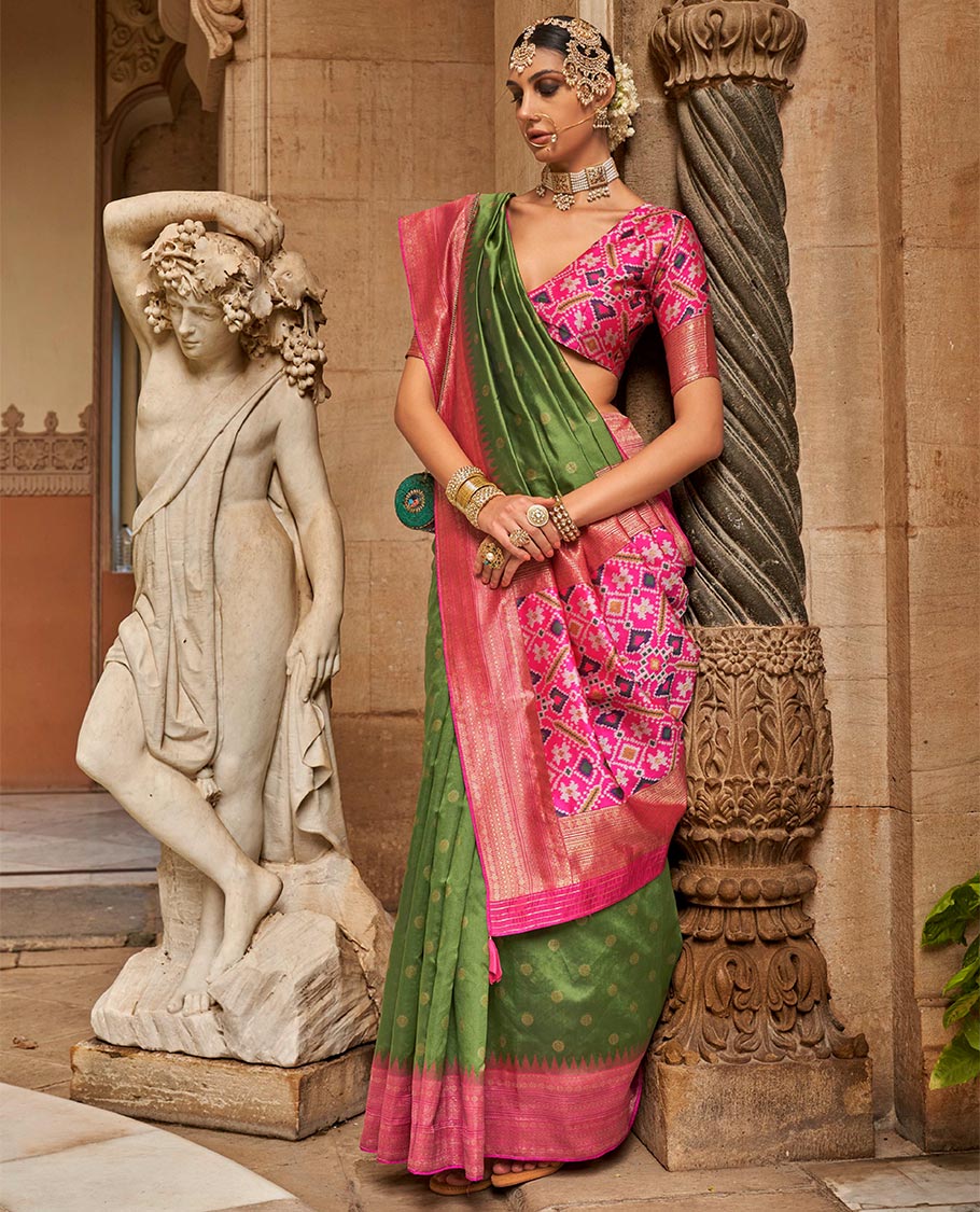 Olive green chakram zari buttas designer catalog saree, contrast temple traditional zari border, and pallu of double ikkat patola weave