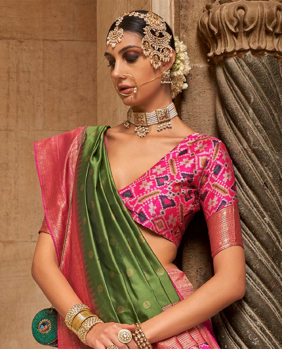 Olive green chakram zari buttas designer catalog saree, contrast temple traditional zari border, and pallu of double ikkat patola weave