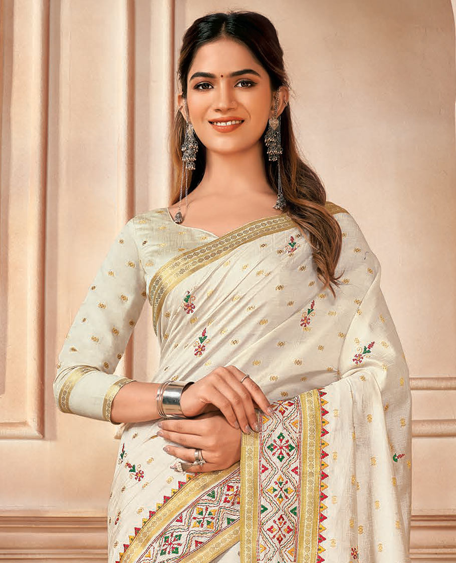 Cream buttas and floral embroidered designer saree, traditional motifs and embroidered border, and pallu of stripes and buttas