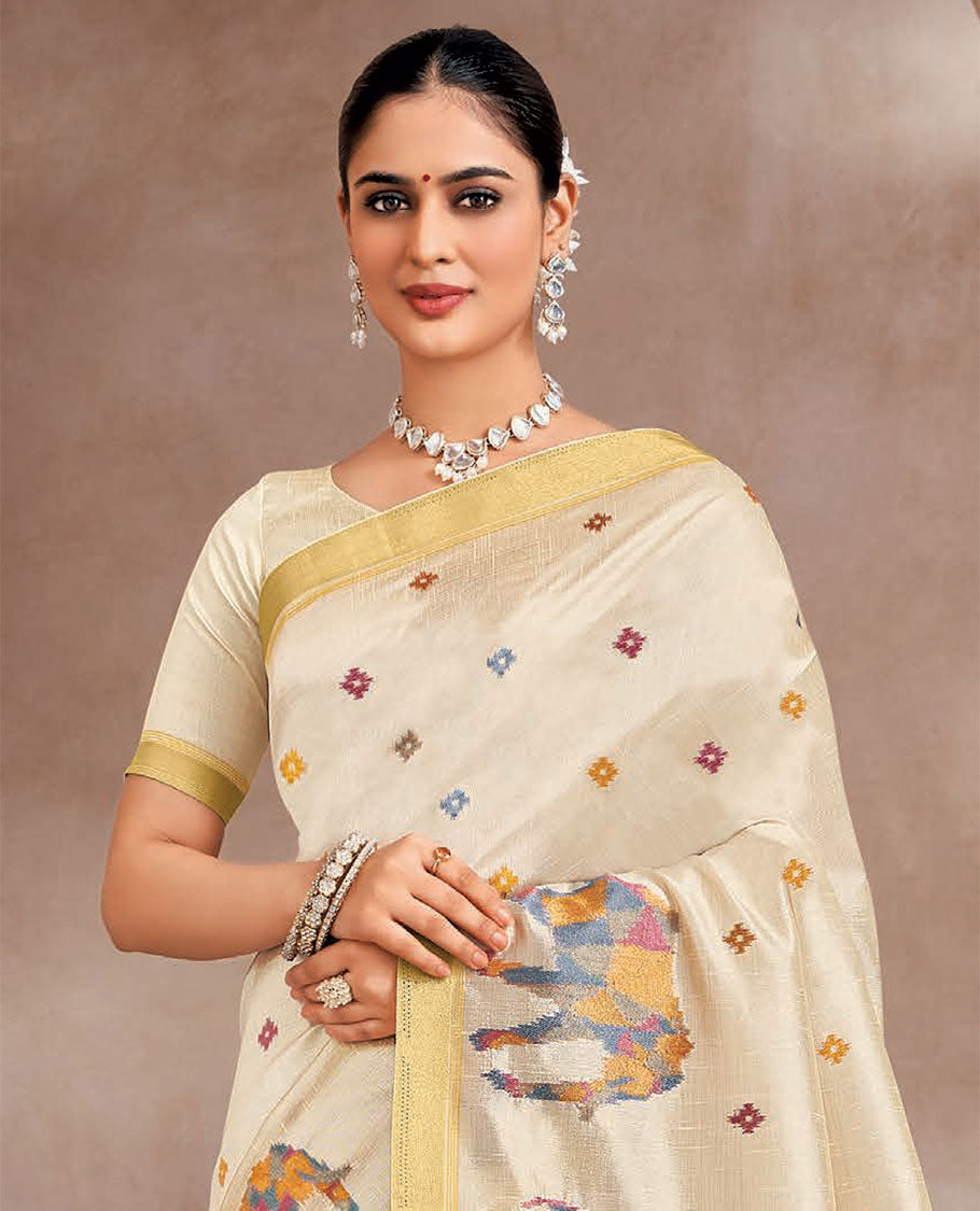 Cream colorful buttas and elephant motifs designer saree, zari border, and striped pallu