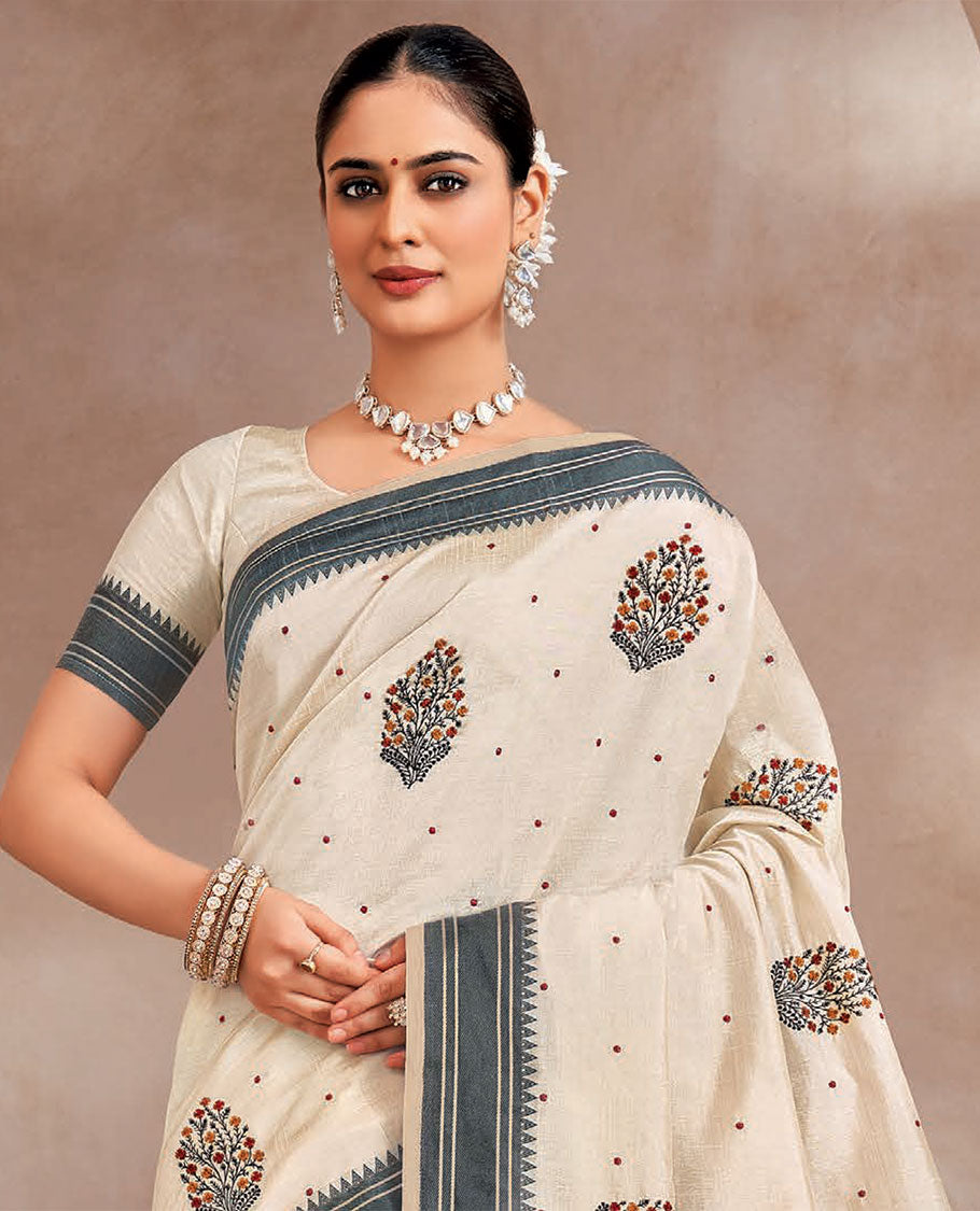 Cream floral vase buttas embroidered designer saree, contrast temple border, and striped pallu