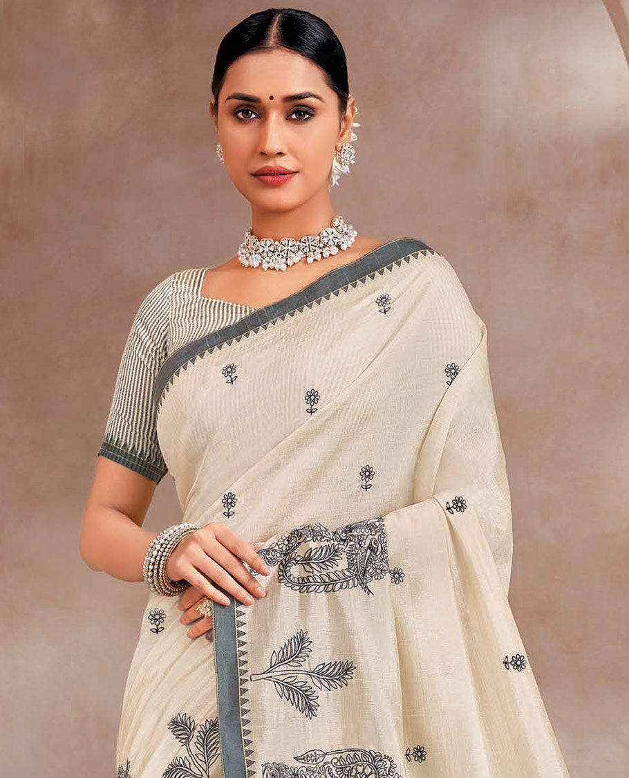 Cream buttas designer saree, elepjhant motifs border, and striped pallu