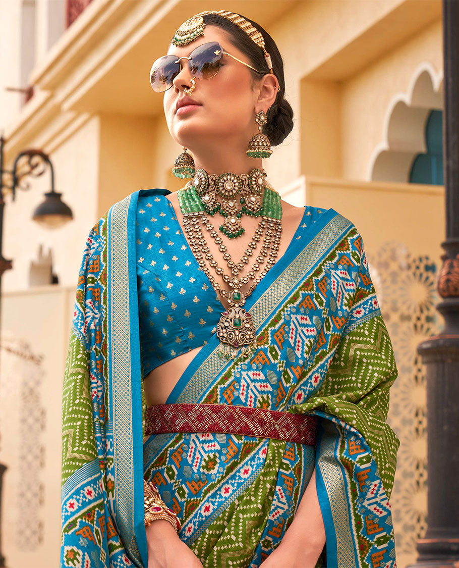 Green-blue patola chevron striped designer catalog saree, contrast diamond ikkat border, and pallu of diamond patterns