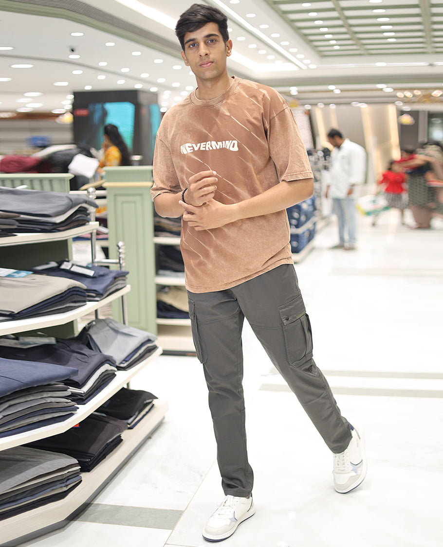 Brown Cotton-Blended T-Shirt, Adorned with Typography Print, Comes with a Crew Neck, Half-Sleeves, Oversized Fit, and Long Length