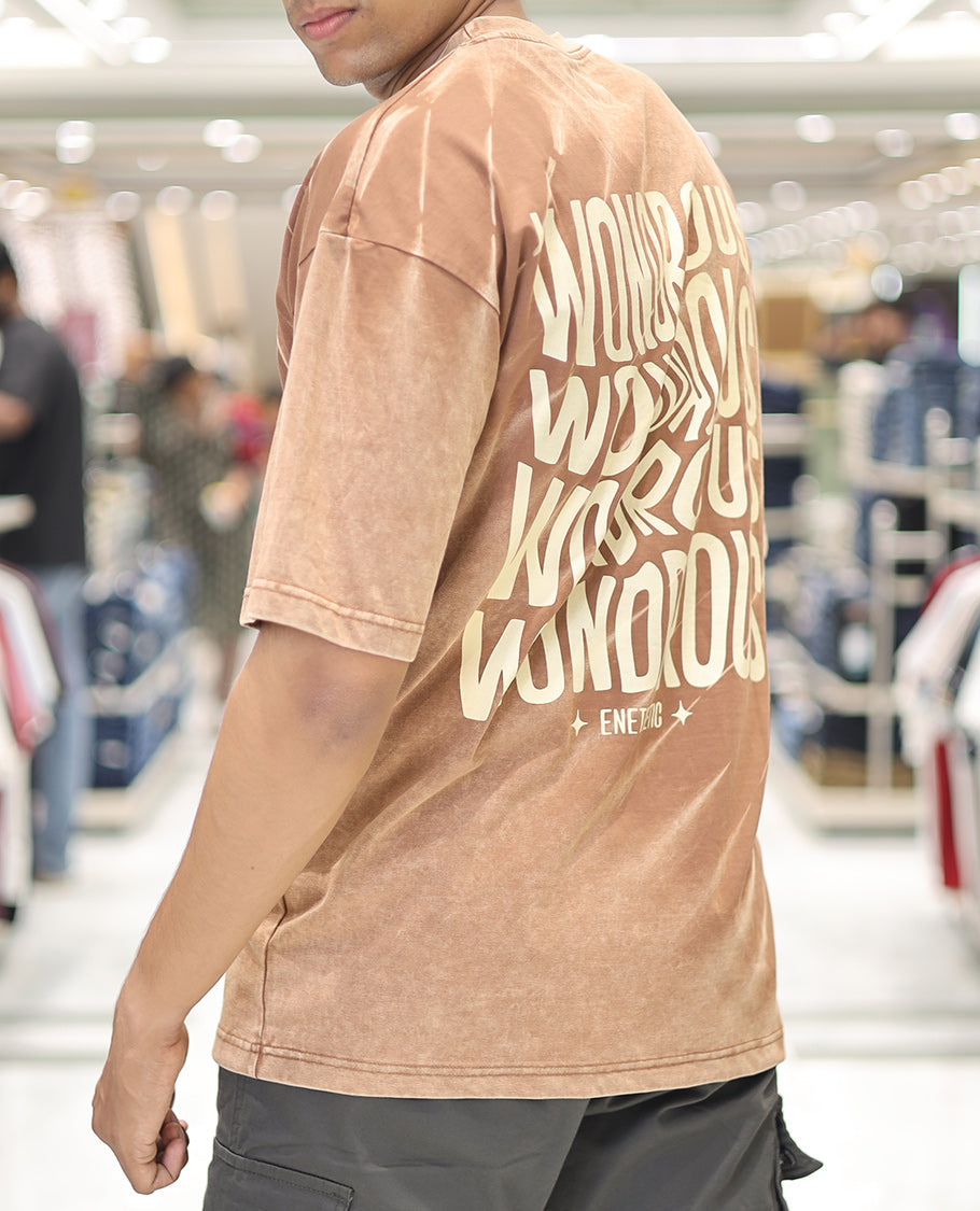 Brown Cotton-Blended T-Shirt, Adorned with Typography Print, Comes with a Crew Neck, Half-Sleeves, Oversized Fit, and Long Length