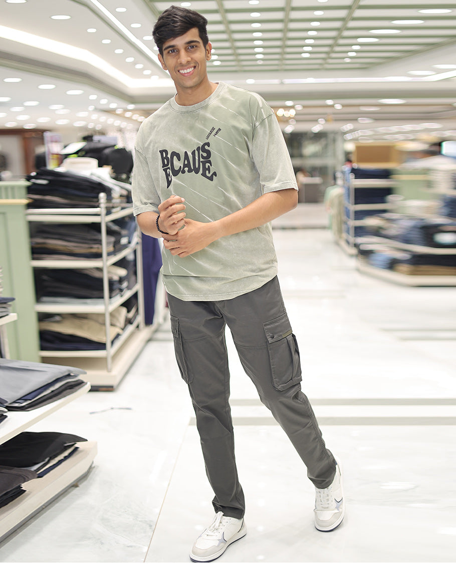 Olive Green Cotton-Blended T-Shirt, Detailed with Typography Print, Comes with a Crew Neck, Half-Sleeves, Oversized Fit, and Long Length