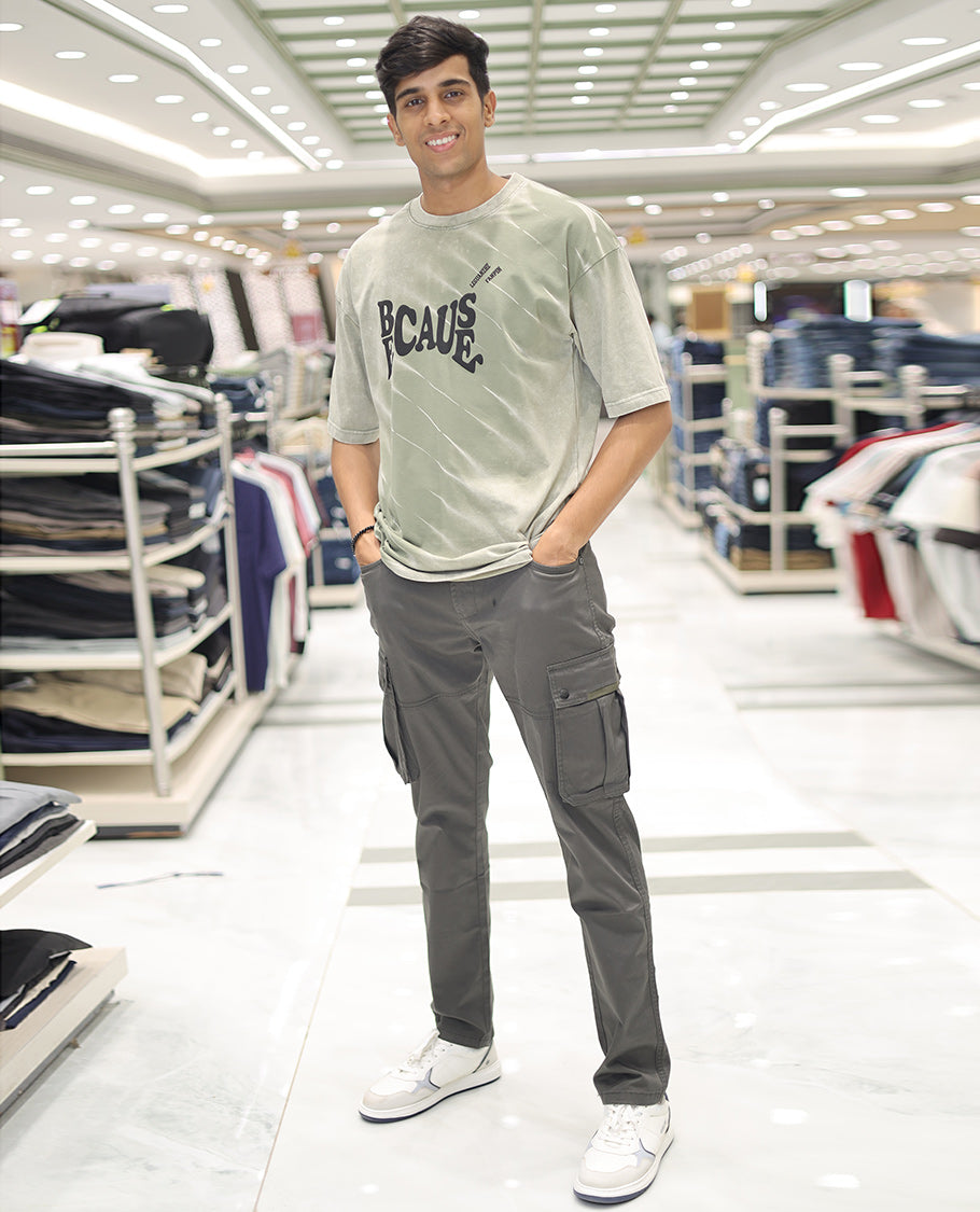 Olive Green Cotton-Blended T-Shirt, Detailed with Typography Print, Comes with a Crew Neck, Half-Sleeves, Oversized Fit, and Long Length