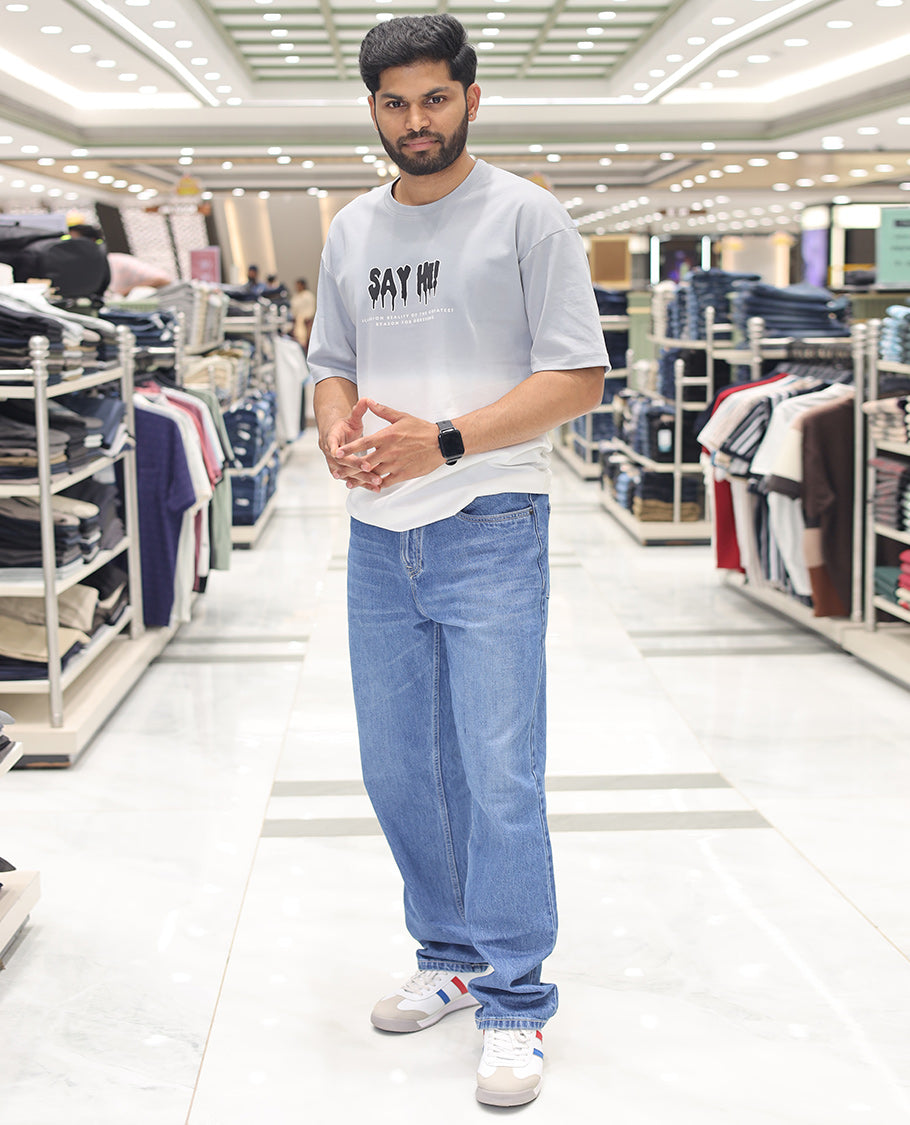 Grey Cotton-Blended Ombre T-Shirt, Artfully Detailed with Funky Motifs and Typography Prints, Comes with a Crew Neck, Half-Sleeves, Oversized Fit, and Long Length