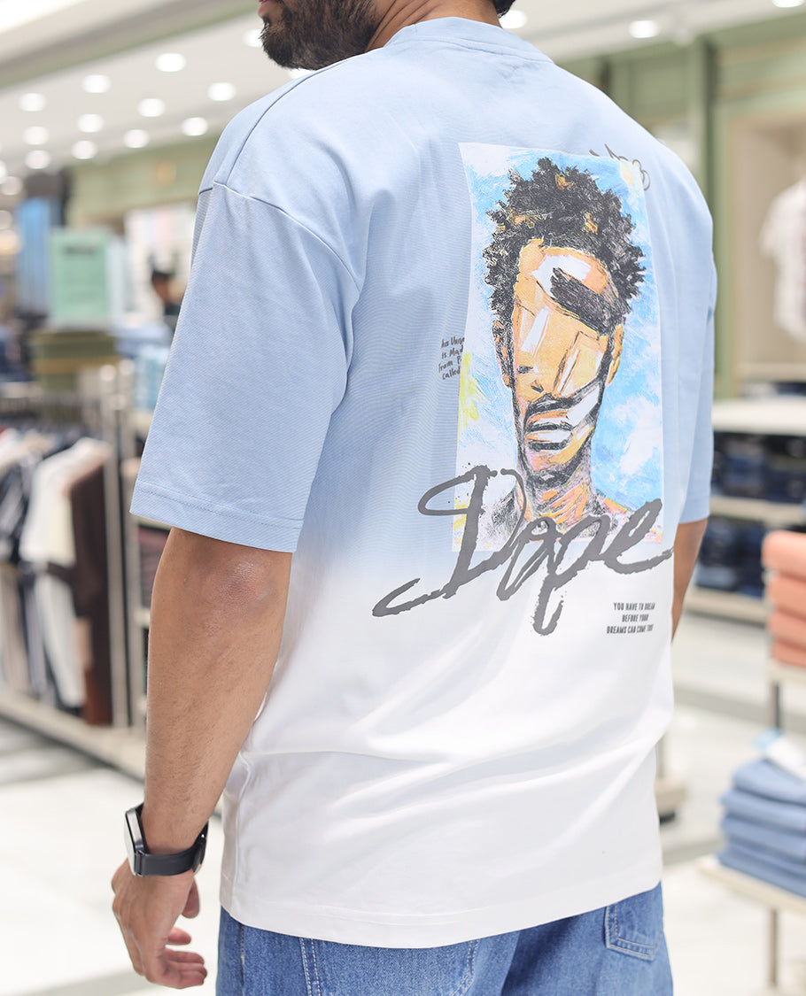 Light Blue Cotton-Blended Ombre T-Shirt, Artfully Detailed with Funky Motifs and Typography Prints, Comes with a Crew Neck, Half-Sleeves, Oversized Fit, and Long Length