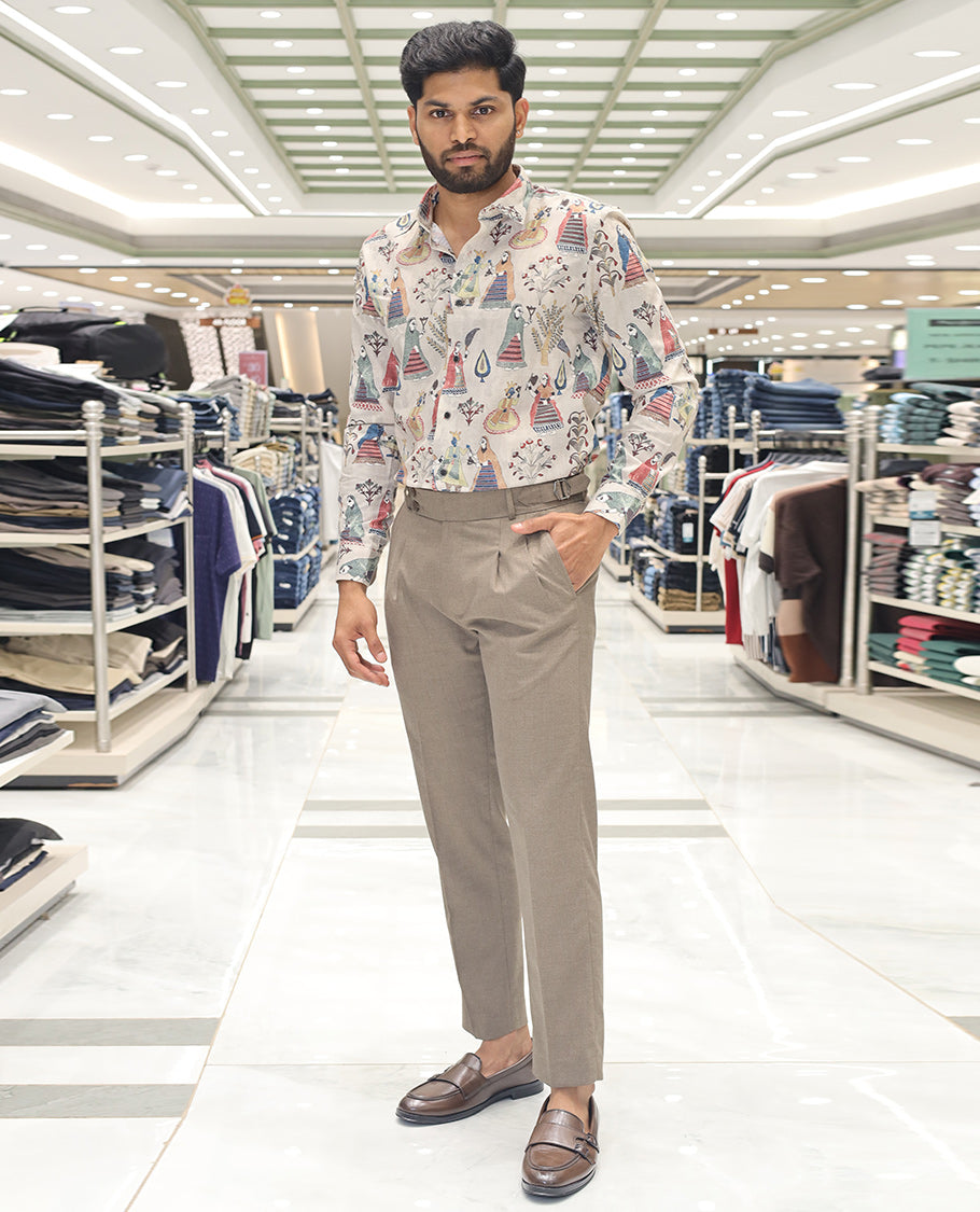 Cream Cotton Blended Casual Shirt, Artfully Designed with Human Motifs Print, Comes with a Spread Collar, Full Sleeves, Slim Fit, and Regular Length