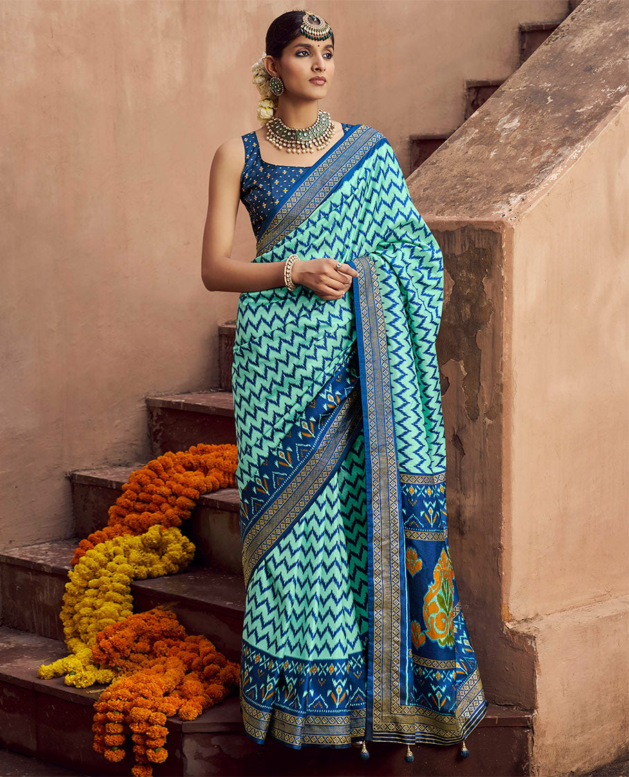 Turquoise Ikat Patola Designer Saree, Adorned with Ikat Chevron Stripes, Complemented by a Contrast Ikat Border, Ikat Woven Pallu, and a Contrast Blouse