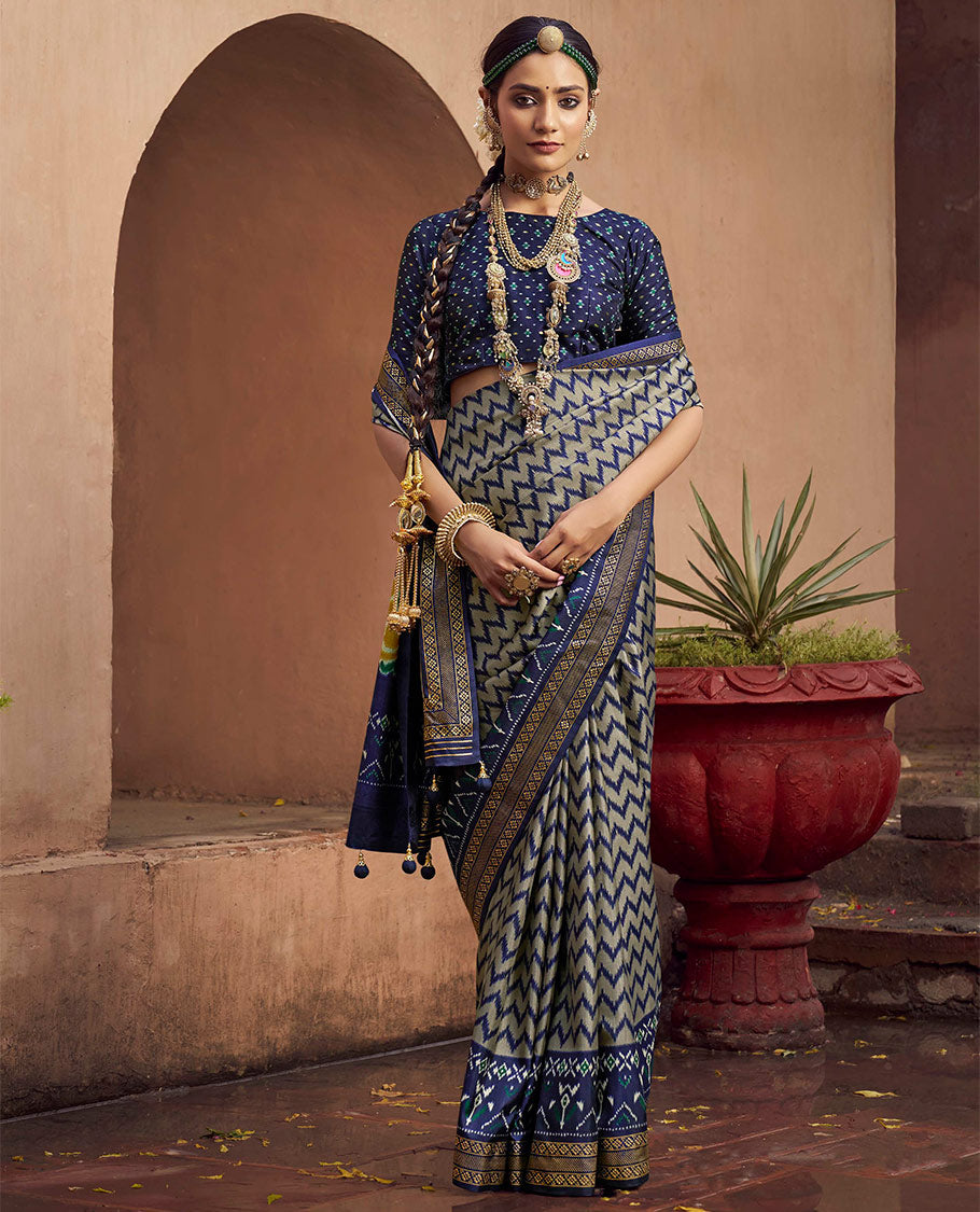 Grey-Blue Ikat Patola Designer Saree, Adorned with Ikat Chevron Stripes, Complemented by a Contrast Ikat Border, Ikat Woven Pallu, and a Contrast Blouse