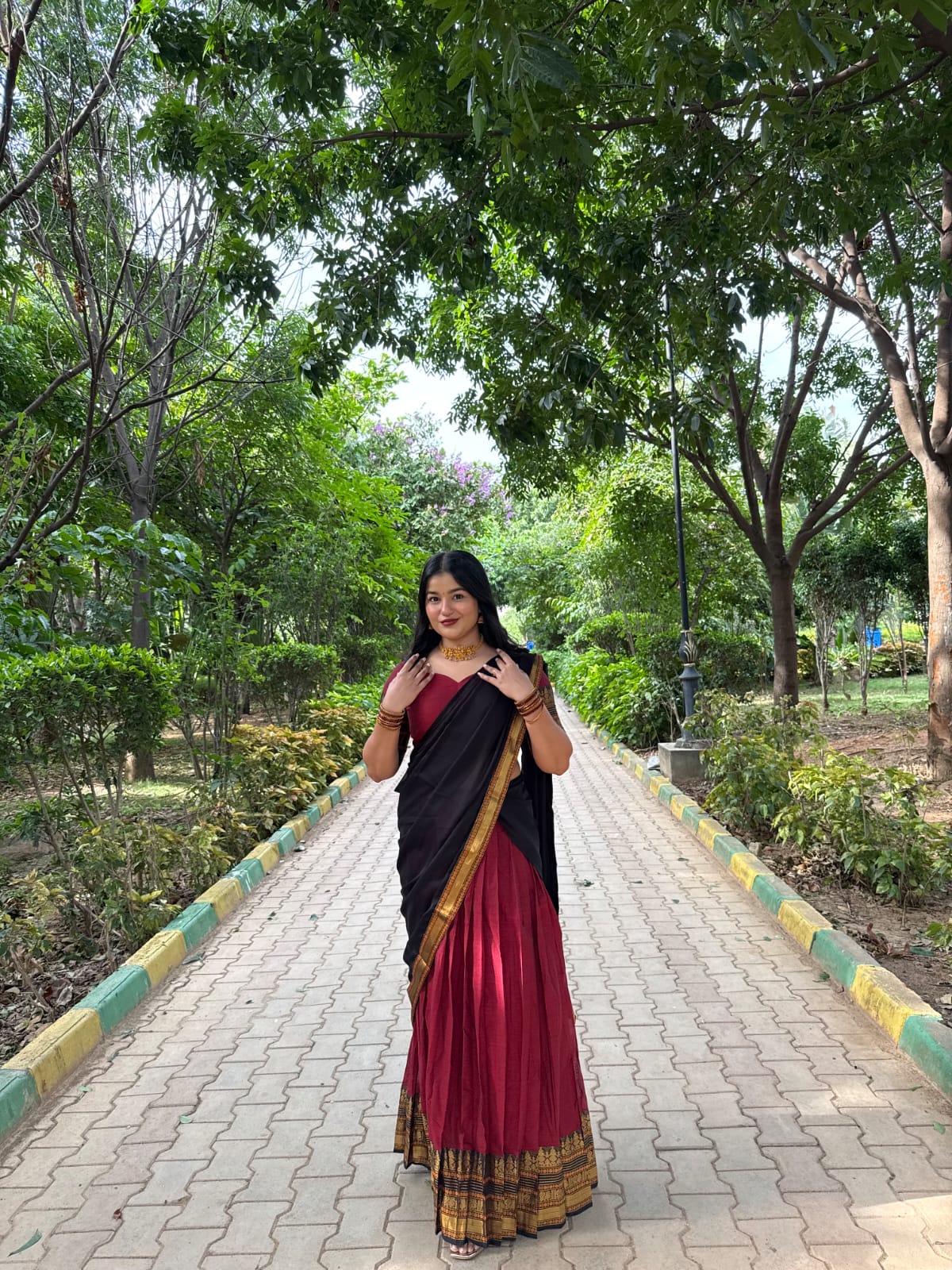 Red-Black Chettinad Cotton Saree Features a Plain Skirt, a Contrast Traditional Zari Border, Matching Blouse, and Contrast Syska Georgette Dhavani