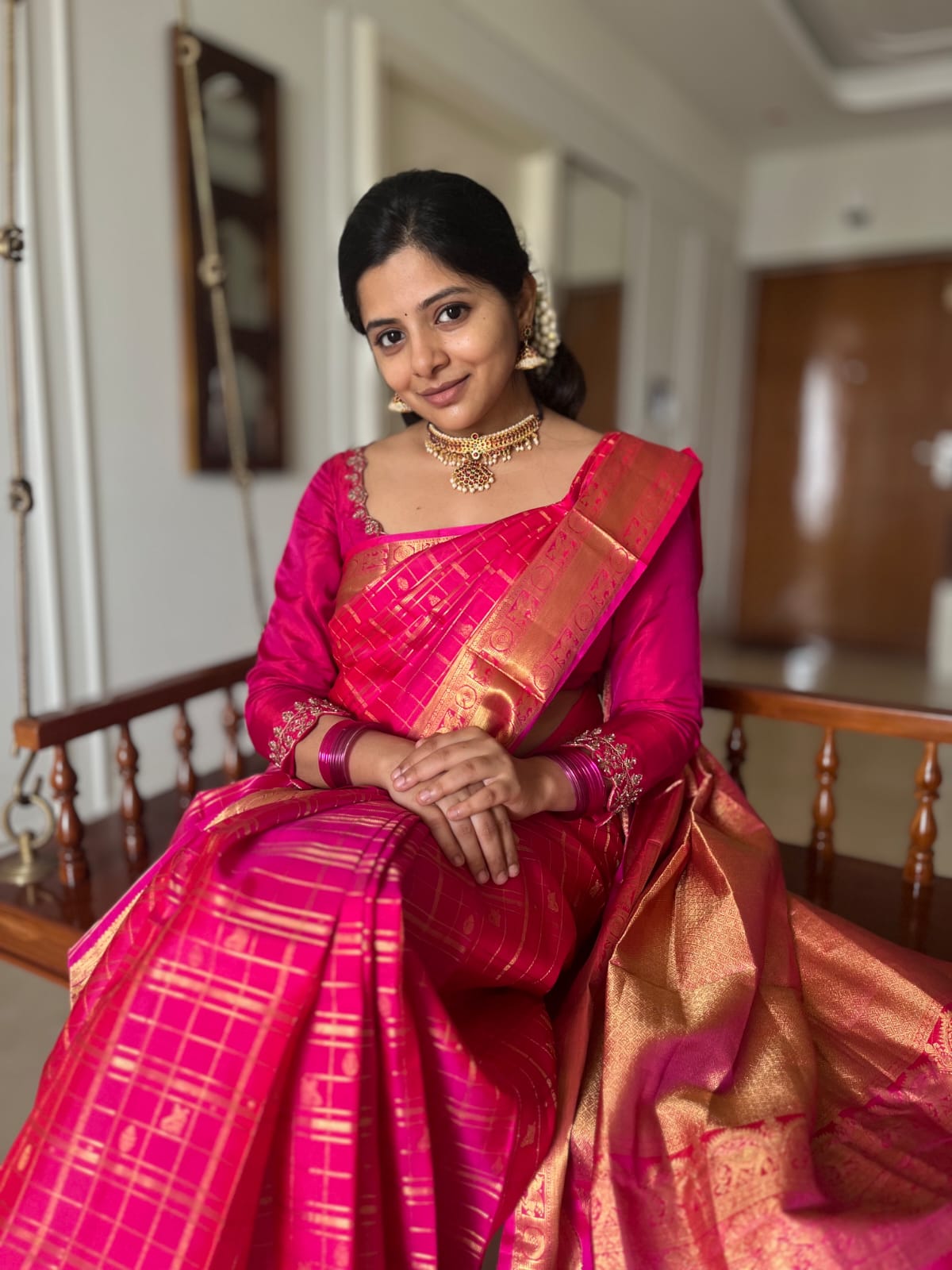 Pink Zari Butta Enclosed Checked Vasundhara Silksaree, a Zari Kuthirai-Chakra Border, a Matching Blouse