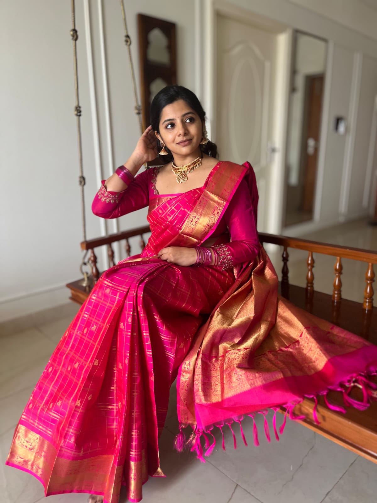 Pink Zari Butta Enclosed Checked Vasundhara Silksaree, a Zari Kuthirai-Chakra Border, a Matching Blouse