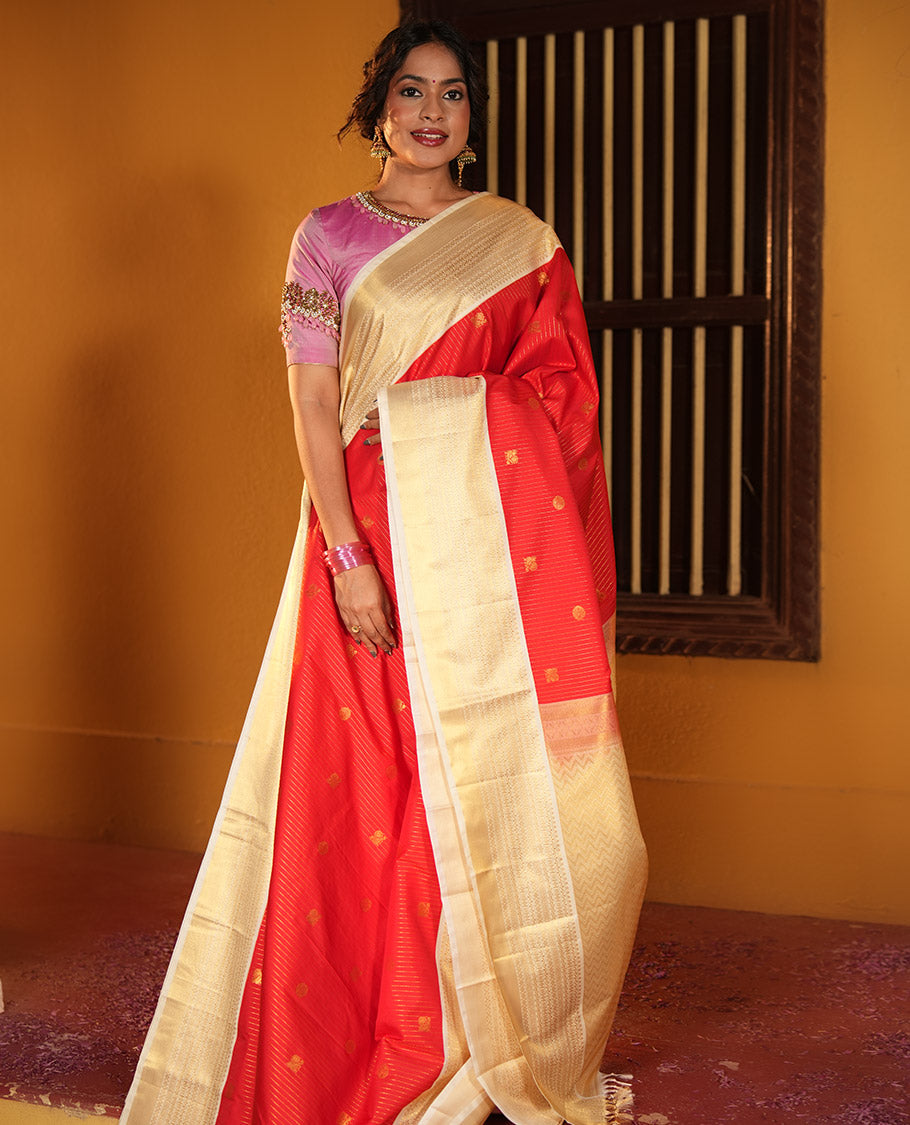 Rust Orange and Off-White Budget Silk Saree, Accentuated with Vaira Oosi, and Mayil-Chakram Designs on Its Body, Complemented by Contrast Traditional Zari Design Border, Chevron-Striped Pallu, and Paired with a Contrast Blouse