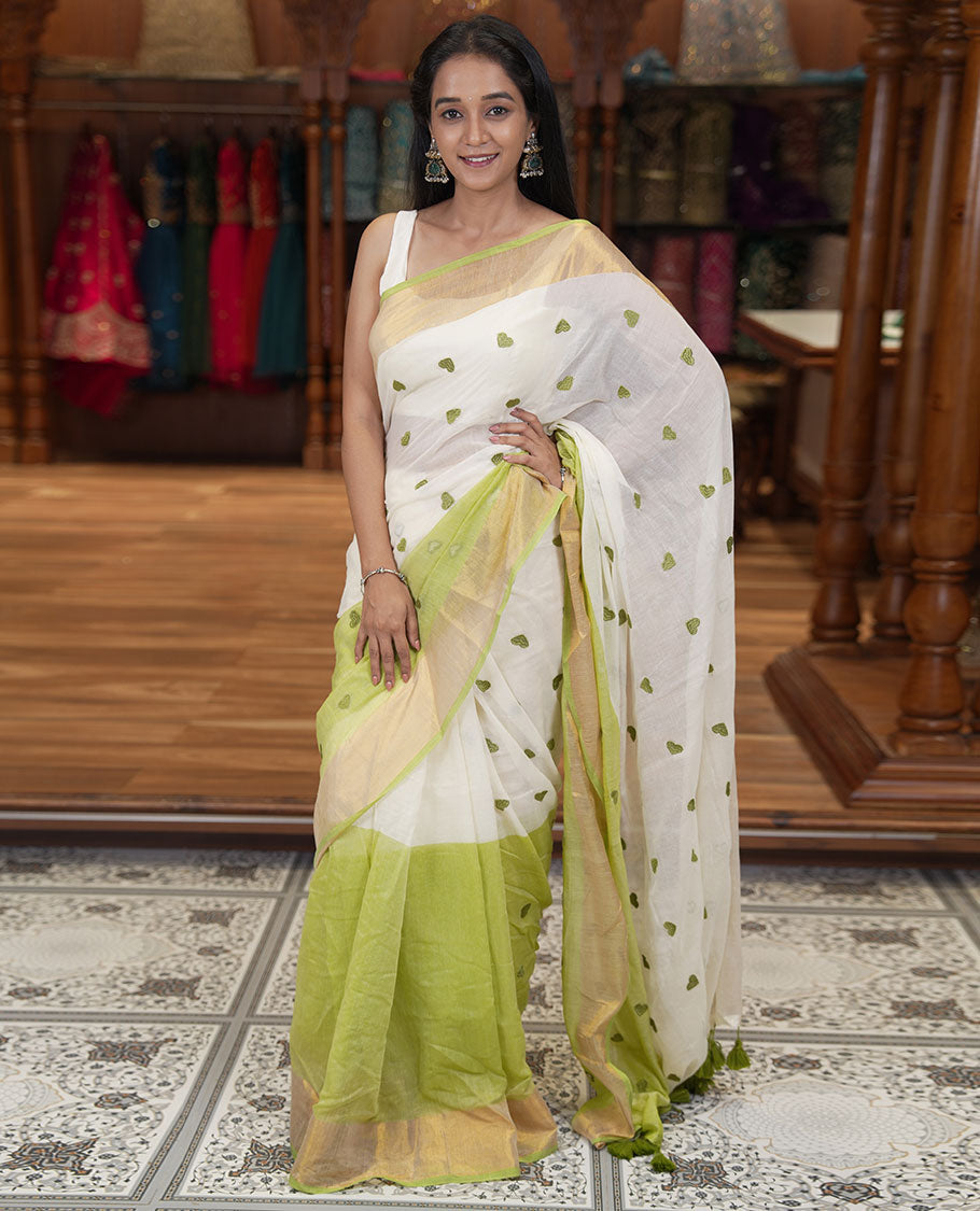 Cream and Pista Green Khadi Mul Cotton Saree, Adorned with Half-And-Half-Style and Heart Motifs Embroidery on Its Body, a Subtle Gold Zari Border, a Self-Pallu, and Has No Blouse