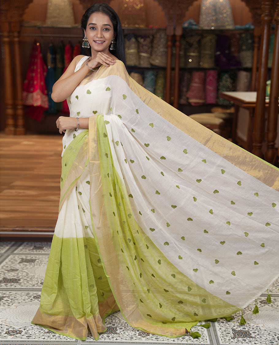 Cream and Pista Green Khadi Mul Cotton Saree, Adorned with Half-And-Half-Style and Heart Motifs Embroidery on Its Body, a Subtle Gold Zari Border, a Self-Pallu, and Has No Blouse