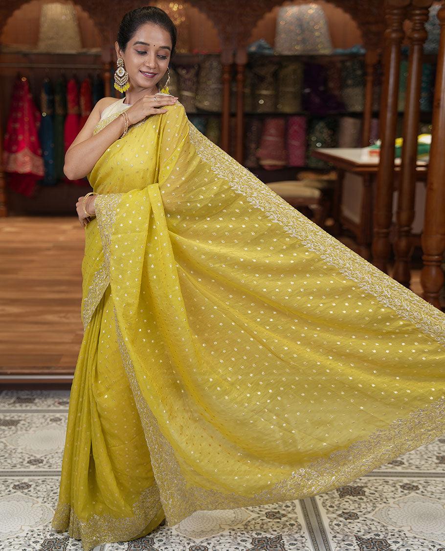 Yellow Fendi Chiffon Saree, Steeped with 1000-Buttas All Over Its Body, Highlighted by a Scallop Embroidered Border, a Self-Pallu, and Paired with a Matching Blouse