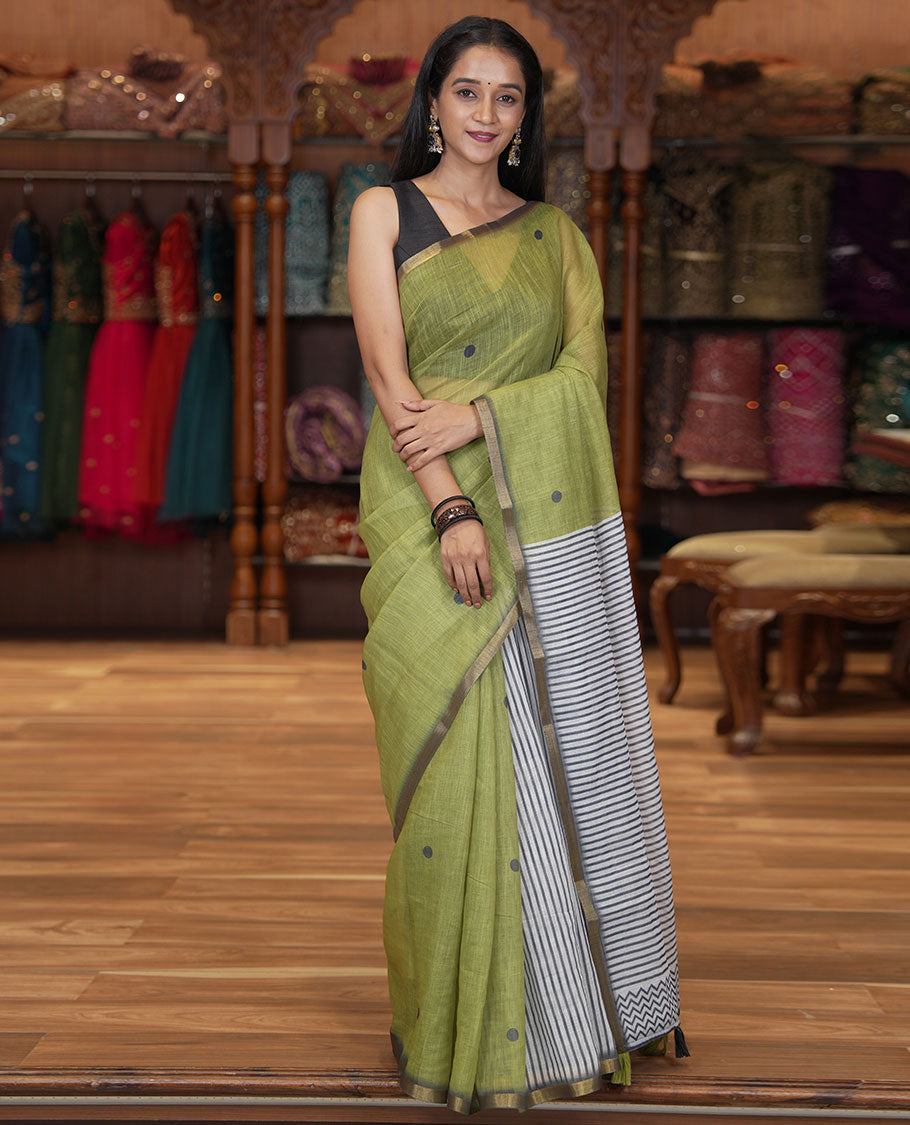 Olive Green Linen Cotton Saree, Adorned with Half-And-Half-Style Polka Dots, a Subtle Piping Border, Contrast Vertically Striped Pallu, and a Contrast Blouse