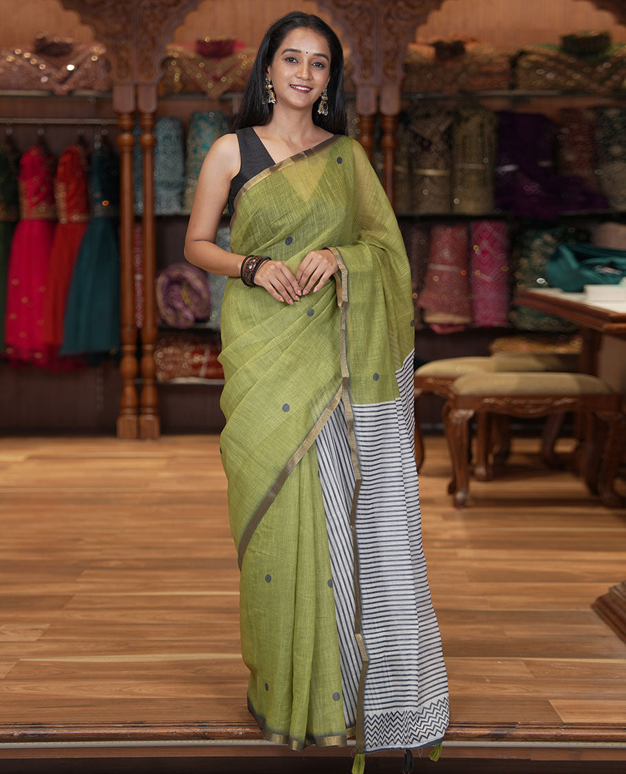 Olive Green Linen Cotton Saree, Adorned with Half-And-Half-Style Polka Dots, a Subtle Piping Border, Contrast Vertically Striped Pallu, and a Contrast Blouse