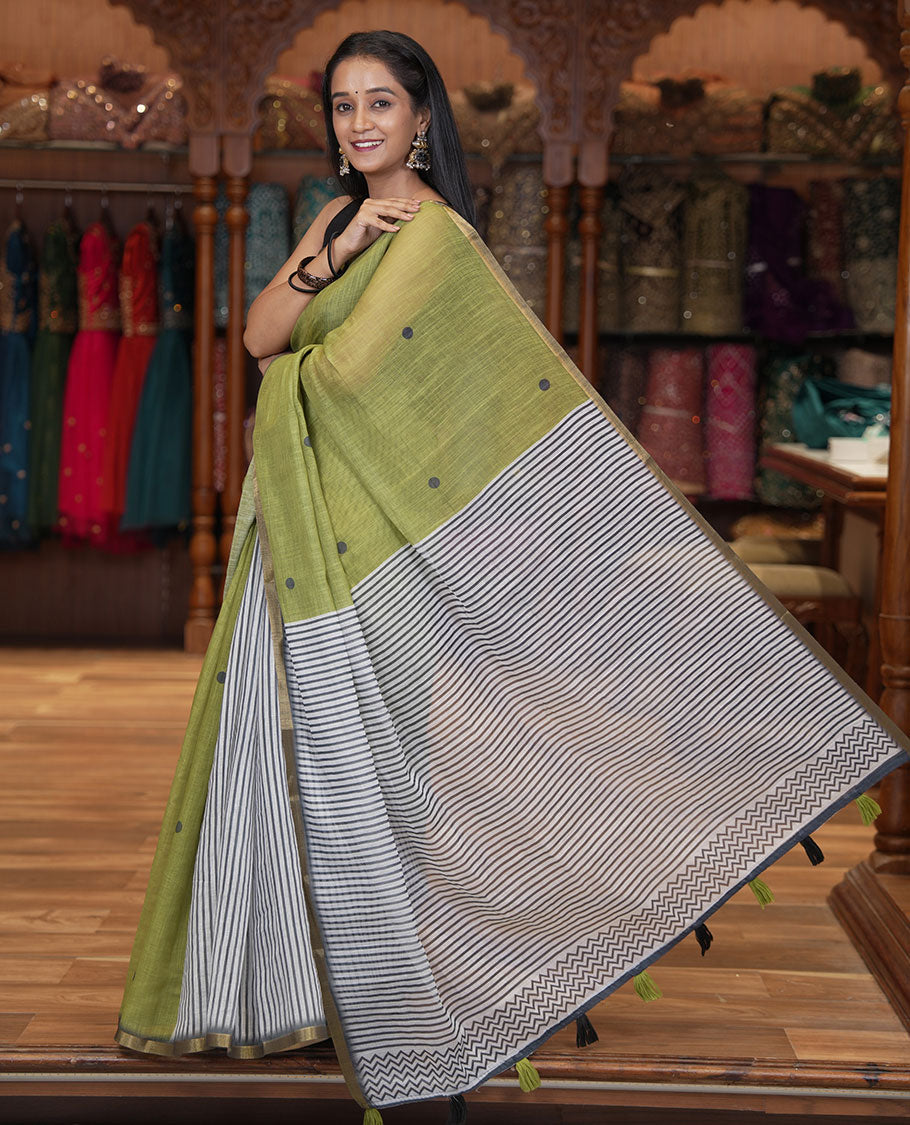 Olive Green Linen Cotton Saree, Adorned with Half-And-Half-Style Polka Dots, a Subtle Piping Border, Contrast Vertically Striped Pallu, and a Contrast Blouse