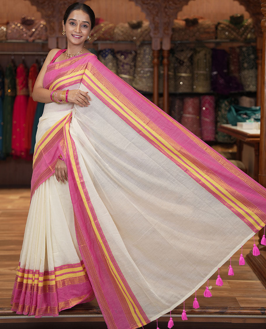 Cream Plain Khadi Mul Cotton Saree, Complemented by a Contrast Traditional Zari Varisai Pettu Border, and a Matching Blouse