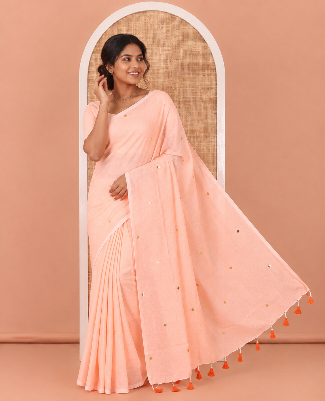 Borderless Orange Mul Cotton Saree, Subtly Sparkled With Big Sequins Work On Its Body, a Self-Pallu and Paired with a Matching Blouse