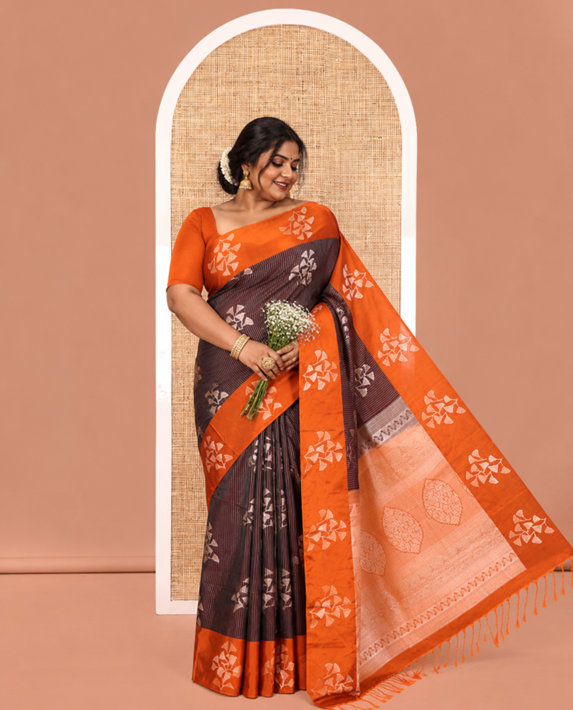 Coffee Brown Semi-Soft Silk Saree, Highlighted by Vaira Oosai Stripes and Floral Buttas All Over Its Body, Complemented by a Contrast Floral Buttas Border, an Intricately Designed Pallu, and Paired with a Contrast Blouse