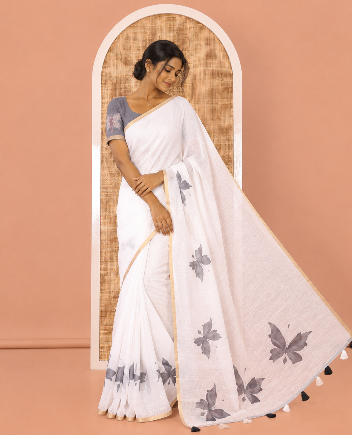 White Linen Cotton Saree, Enthralled with Butterfly Buttas All Over Its Body, Subtle Piping Border, Pallu of Butterfly Print, and Paired with a Contrast Fairy Motifs Printed Blouse