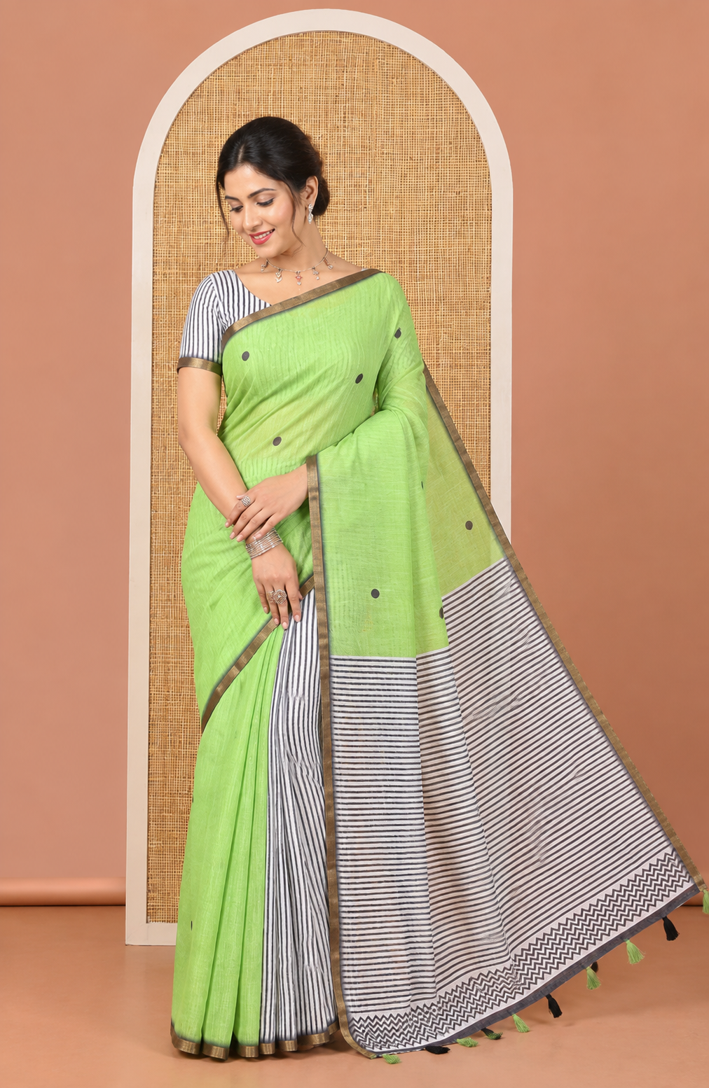 Parrot Green Linen Cotton Saree, Adorned with Half-And-Half-Style Polka Dots, a Subtle Piping Border, Contrast Vertically Striped Pallu, and a Contrast Blouse
