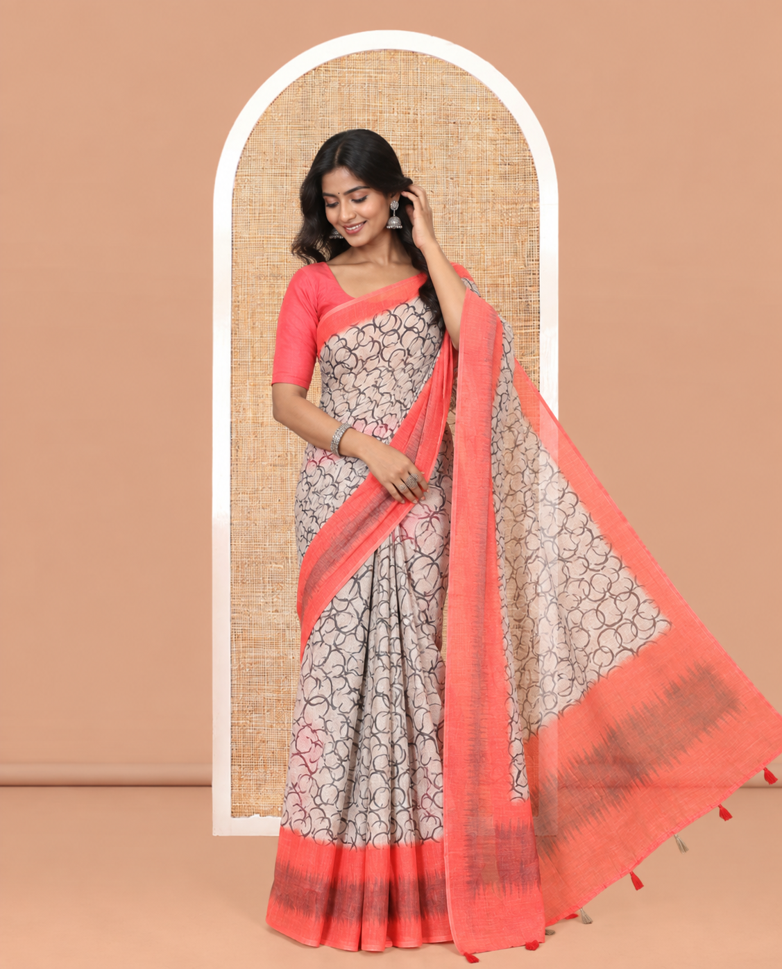 Chikku-Orange Linen Cotton Saree, Elevated with Geometric Print, a Contrast Ikat Border, Printed Pallu, and Contrast Blouse